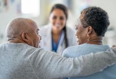 Couple at home speaking to doctor